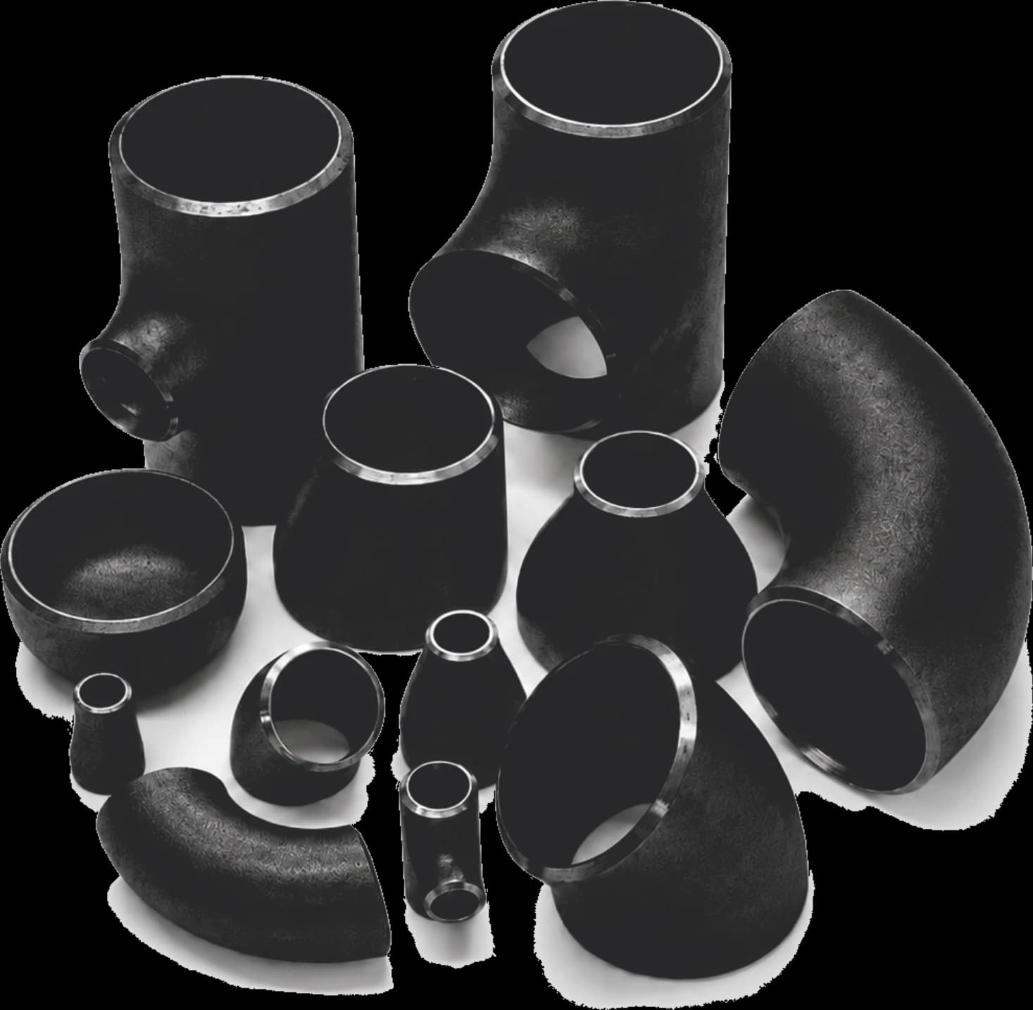 Assortment of carbon steel buttweld pipe fittings including elbows, tees, and reducers